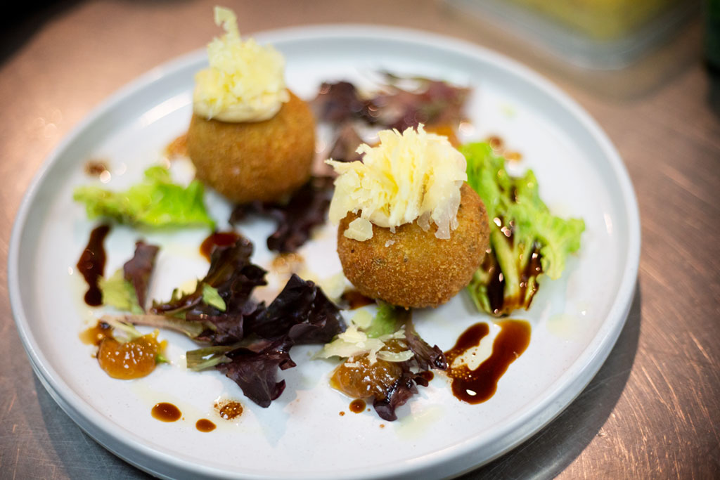 Crumbed rice balls with four cheeses, garlic & herbs